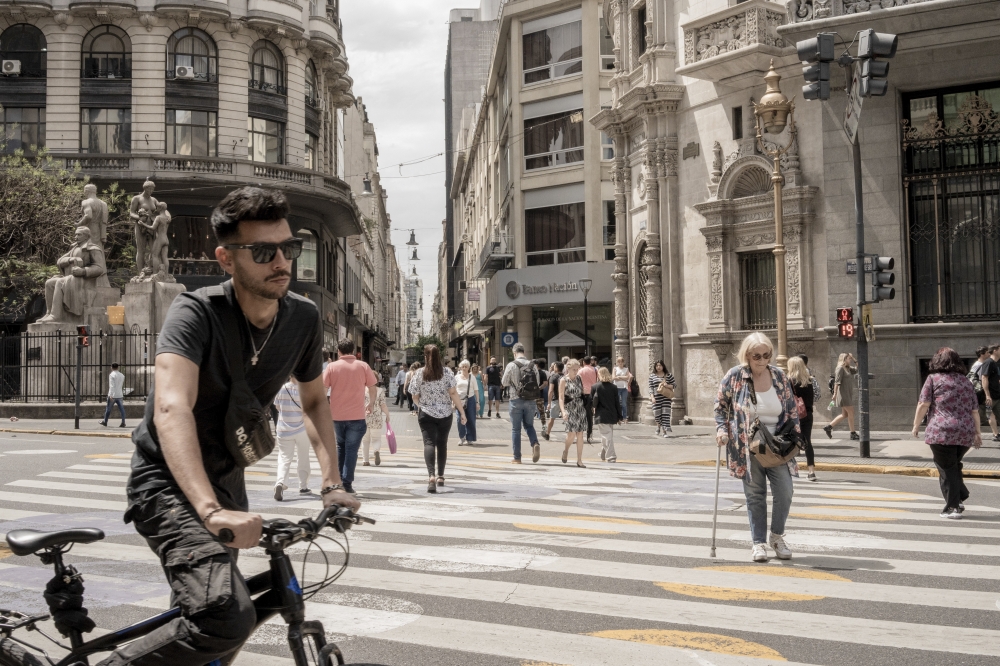 People cross an avenue in downtown Buenos Aires, Argentina, on Nov. 21, 2023. (Anita Pouchard Serra/The New York Times)