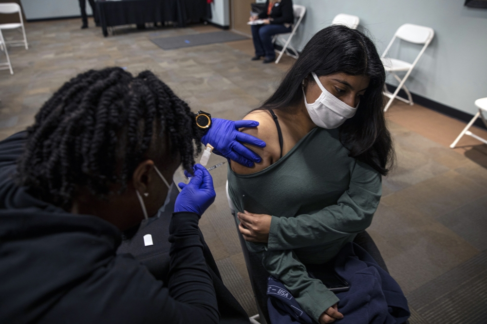 Vaccination in Phoenix at the end of 2021. As Omicron continues to evolve, epidemiologists still see a benefit to vaccinations, possibly saving up to 49,000 lives a year. (Adriana Zehbrauskas/The New York Times)