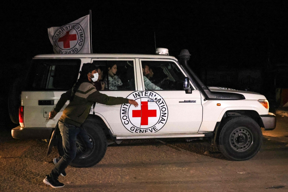 An International Red Cross vehicle reportedly carrying hostages released drives towards the Rafah border point with Egypt ahead of their transfer to Israel. — AFP 