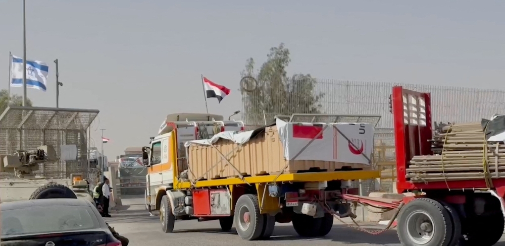 Trucks carrying humanitarian aid being transported to Gaza