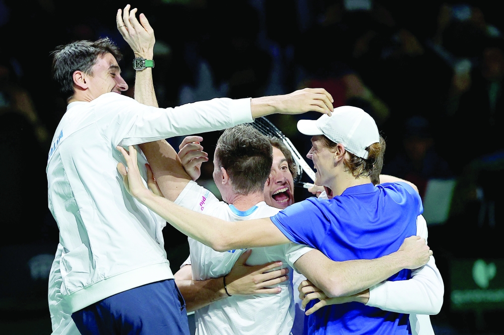 Italy's Jannik Sinner (R) and teammates celebrate winning the Davis Cup. — AFP

