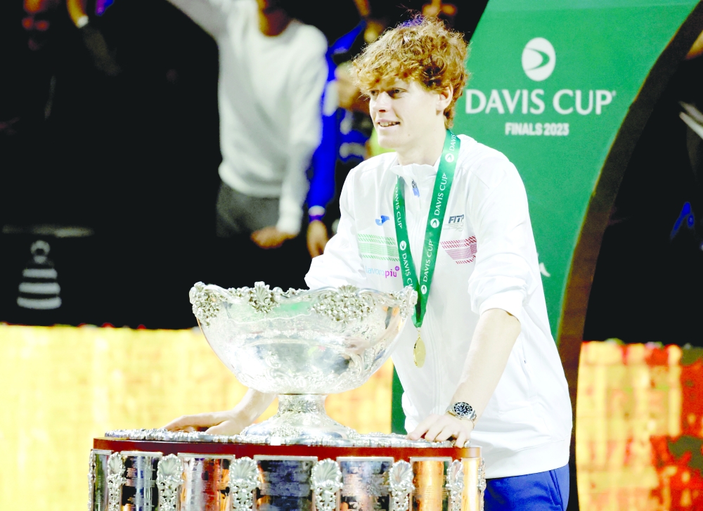  Italy's Jannik Sinner celebrates with the trophy after winning the Davis Cup. — Reuters
