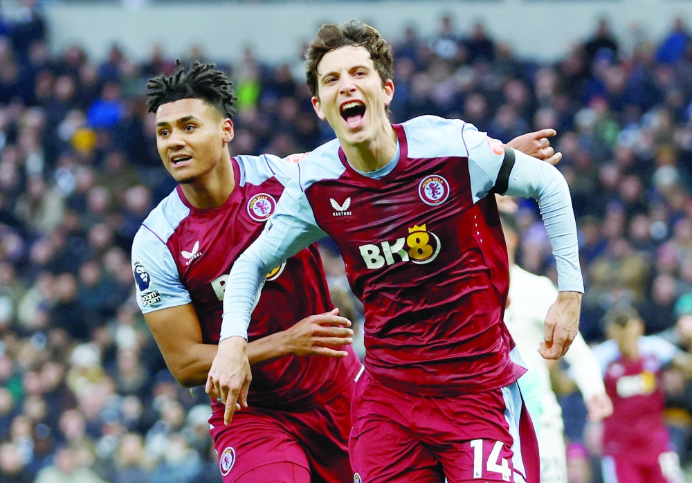 Aston Villa's Pau Torres celebrates scoring their first goal with Ollie Watkins. — Reuters