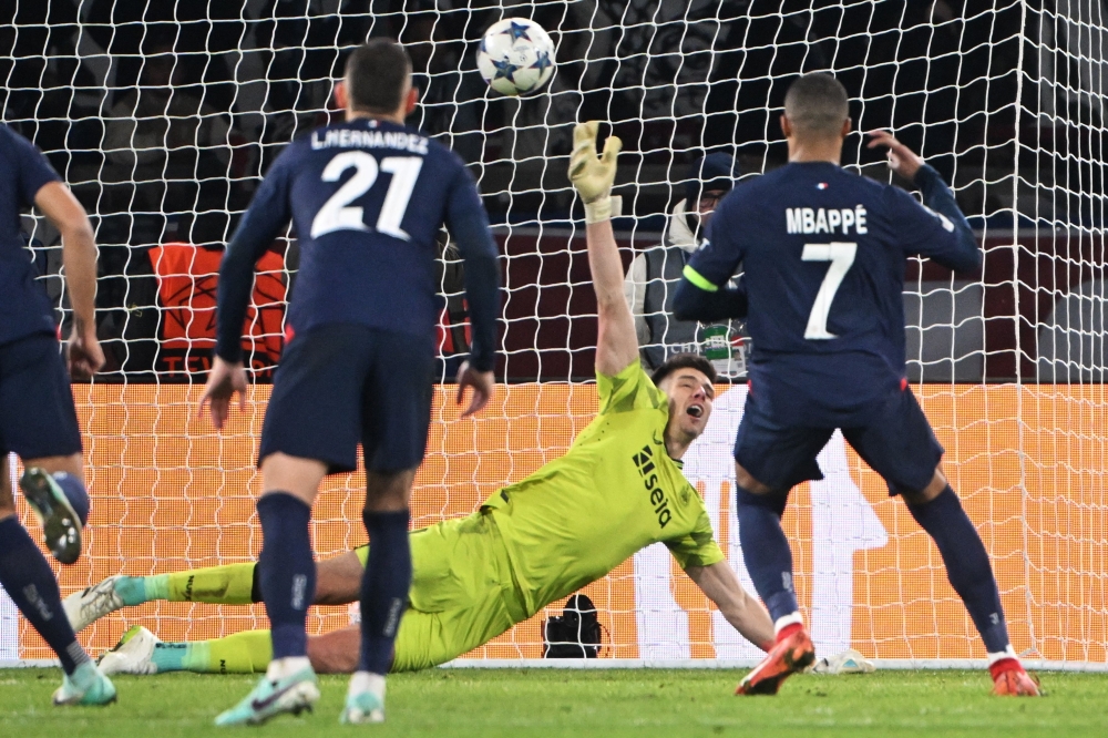  Kylian Mbappe (R) scores a penalty kick in front of Newcastle  at the Parc des Princes stadium in Paris. — AFP

