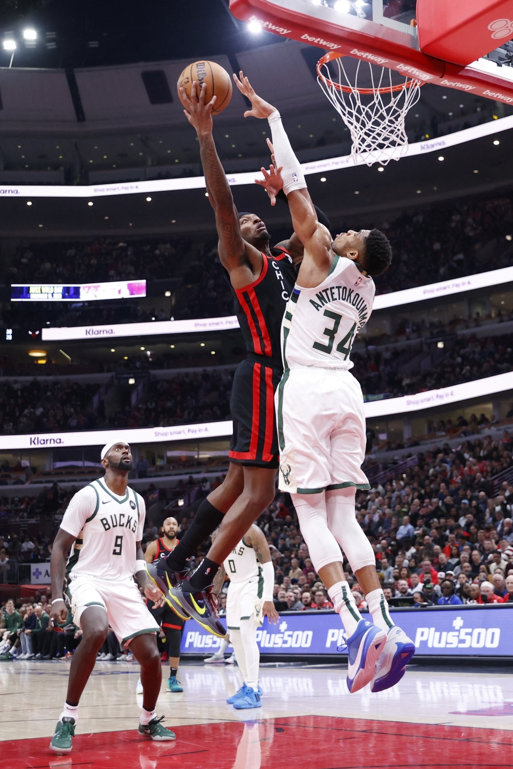 Nov 30, 2023; Chicago, Illinois, USA; Chicago Bulls forward Torrey Craig (13) goes to the basket against Milwaukee Bucks forward Giannis Antetokounmpo (34) during the second half at United Center. Mandatory Credit: Kamil Krzaczynski-USA TODAY Sports
