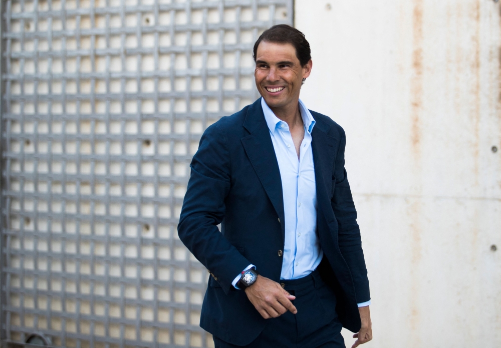 (FILES) Spanish tennis player Rafael Nadal gestures as he talks during a press conference to announce he will not compete in the French Open, at the Rafa Nadal Academy in Manacor, on the Spanish Balearic Island of Mallorca, on May 18, 2023.  Spaniard Rafael Nadal, absent from the courts for almost a year with a hip injury, announced on December 1, 2023 that he would return to competition in Brisbane next month ahead of the Australian Open. (Photo by JAIME REINA / AFP)

