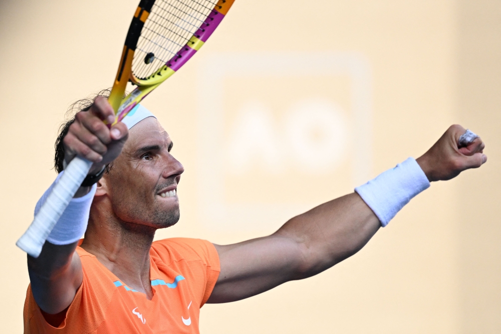 (FILES) Spain's Rafael Nadal celebrates after winning against Britain's Jack Draper during their men's singles match on day one of the Australian Open tennis tournament in Melbourne on January 16, 2023. Spaniard Rafael Nadal, absent from the courts for almost a year with a hip injury, announced on December 1, 2023 that he would return to competition in Brisbane next month ahead of the Australian Open. (Photo by WILLIAM WEST / AFP)

