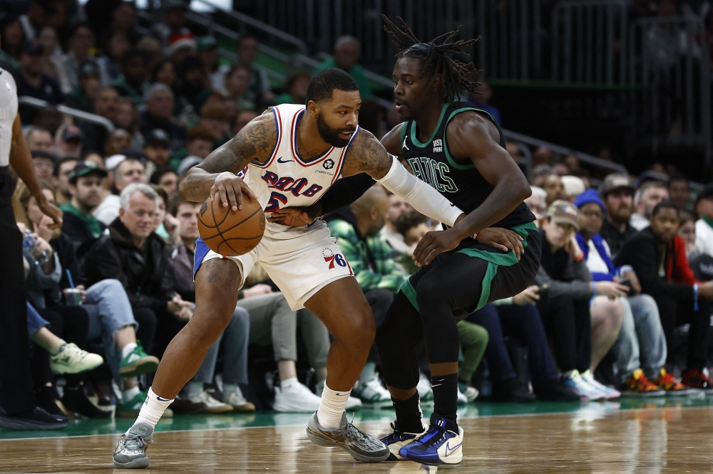 Marcus Morris Sr. (5) tries to hold off Jrue Holiday (4) at TD Garden.— USA TODAY Sports
