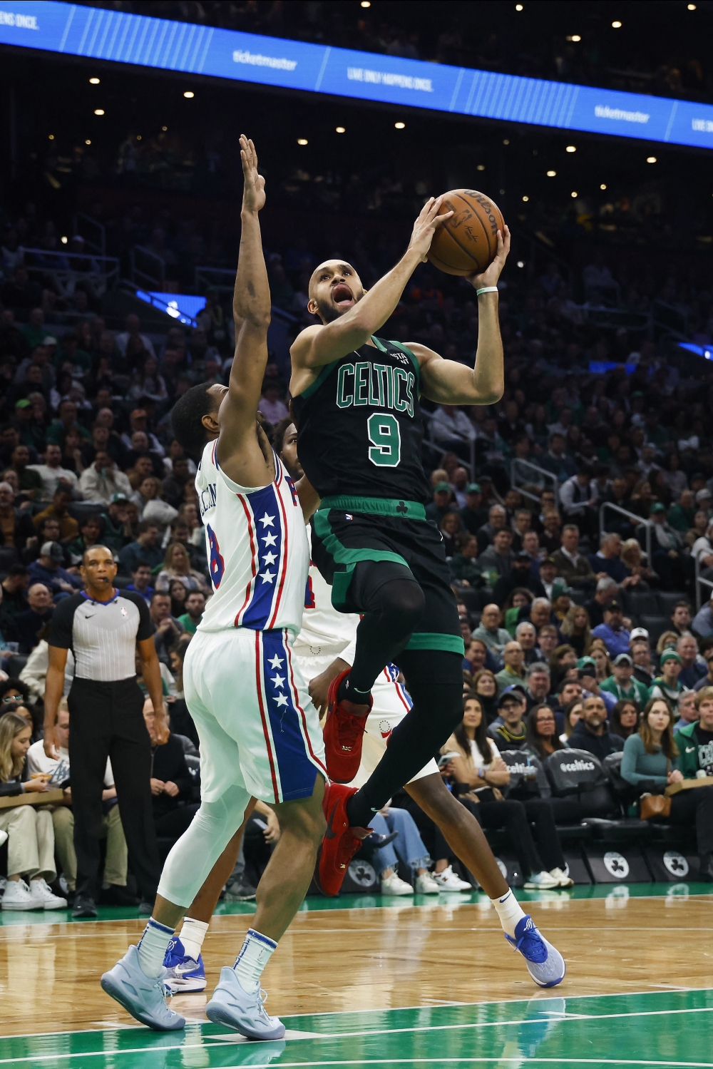 guard Derrick White (9) goes to the basket against De'Anthony Melton (8) during the second half at TD Garden.— USA TODAY Sports
