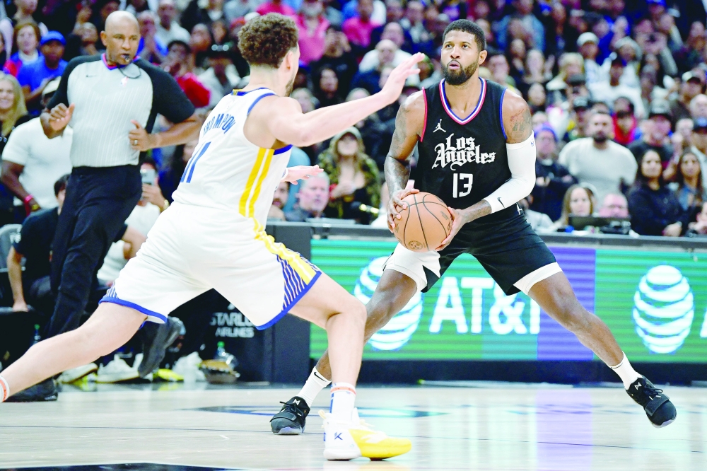 Paul George (13) controls the ball against Klay Thompson (11) during the second half at Crypto. — USA TODAY Sports