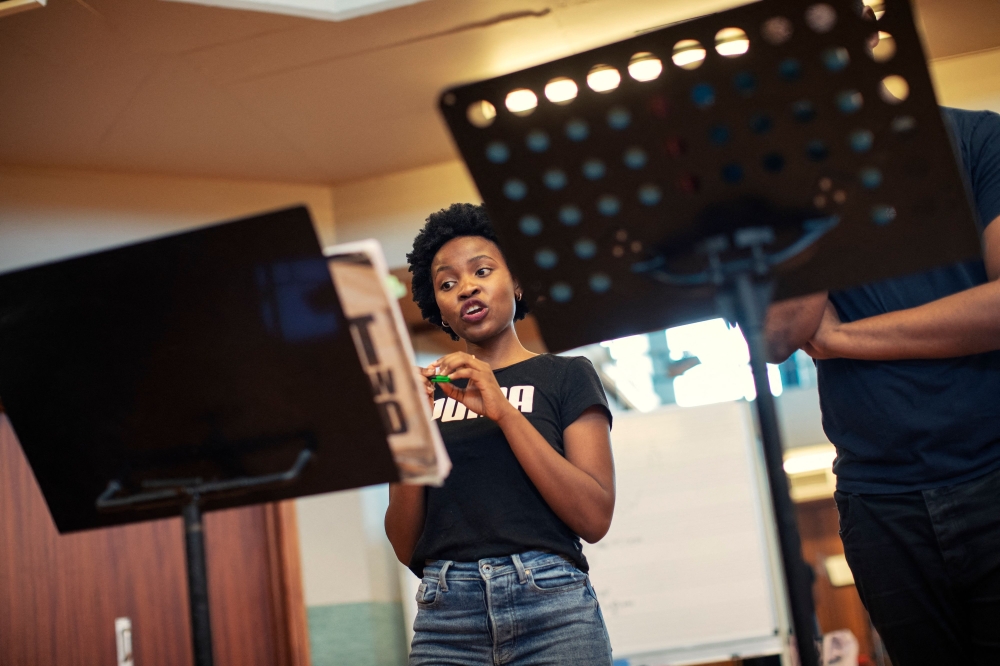 First year post graduate opera student Siphosihle Letsoso practices during a rehearsal of Mozart痴 Le Nozze Di Figaro at the University of Cape Town (UCT) School of Music in Cape Town on November 15, 2023.  The University of Cape Town (UCT) School of Opera is home to what is arguably Africa's most prestigious opera school. The prestigious Cape Town academy is the only opera school in South Africa with a comprehensive curriculum, including music, singing, as well as acting and opera languages like Italian, French and German while offering music lessons in disadvantaged areas of Cape Town in the lookout for promising voices. (Photo by GIANLUIGI GUERCIA / AFP)

