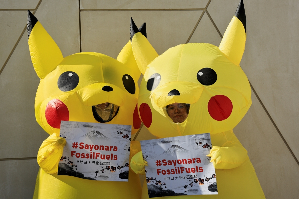 Activists dressed as Pikachu participate in a protest against fossil fuel at the United Nations Climate Change Conference (COP28) in Dubai. - Reuters


