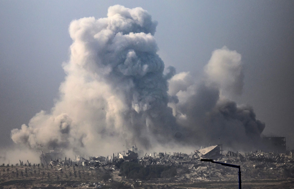 This picture shows smoke billowing after an Israeli strike in Gaza. — AFP 