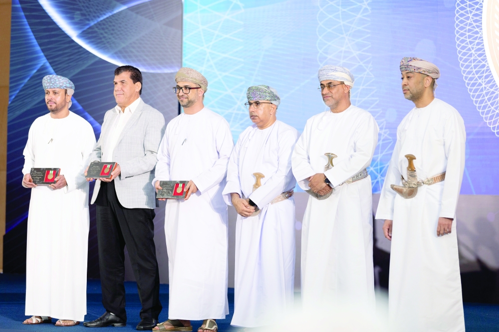 Dr Hilal bin Ali al Sabti, Minister of Health, with National Research Award award winners in Muscat on Monday.