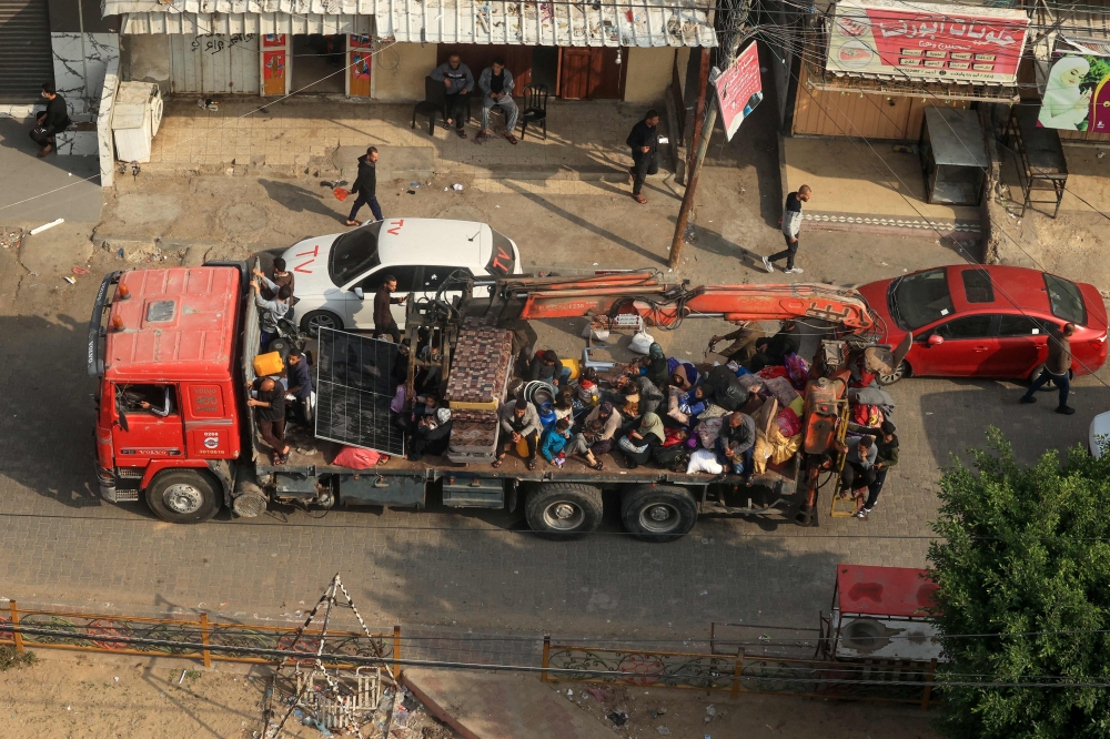 Palestinians fleeing Khan Yunis arrive in Rafah further south the strip. — AFP 