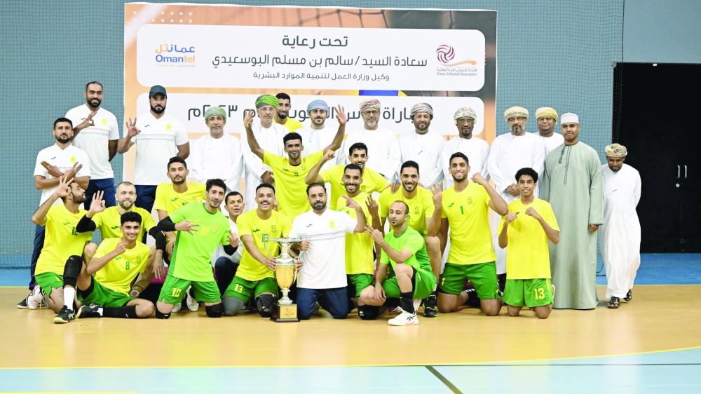 Seeb players celebrate with officials after winning the volleyball Super Cup.