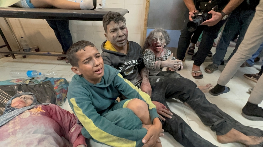Palestinians children wounded in Israeli strikes wait to be assisted at Nasser hospital in Khan Younis in the southern Gaza Strip. - Reuters