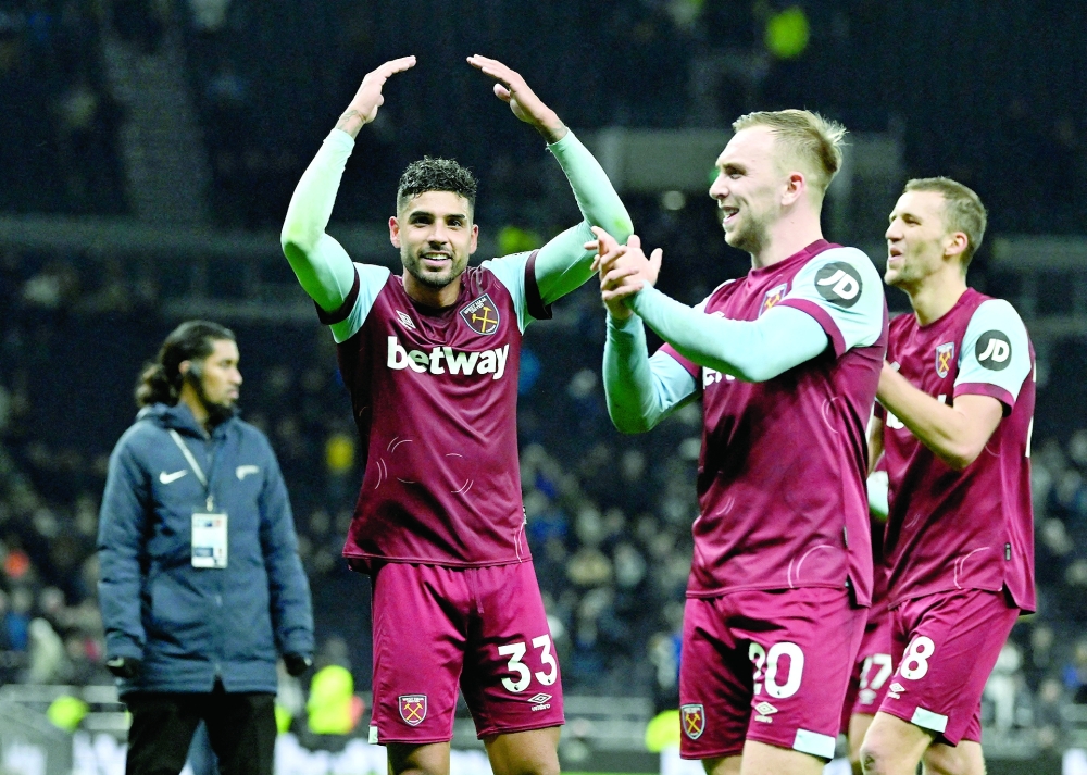 Soccer Football - Premier League - Tottenham Hotspur v West Ham United - Tottenham Hotspur Stadium, London, Britain - December 7, 2023 West Ham United's Jarrod Bowen and Emerson Palmieri celebrate after the match REUTERS