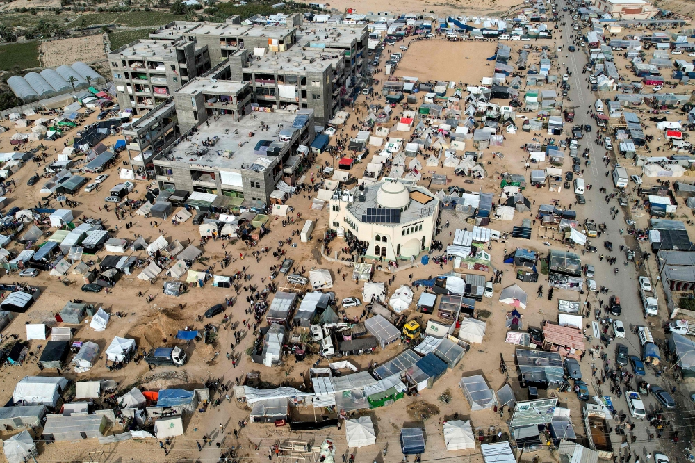 Makeshift tent camps housing Palestinians displaced by intense Israeli bombardment on the Gaza Strip