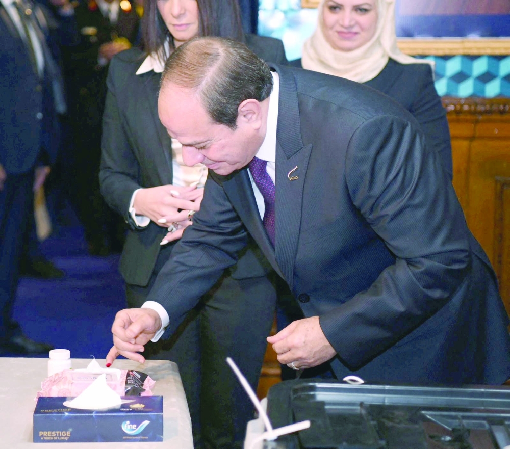 Egyptian President Abdel Fattah al Sisi casts his ballot at a polling station on the first day of the presidential election in Cairo. - Reuters