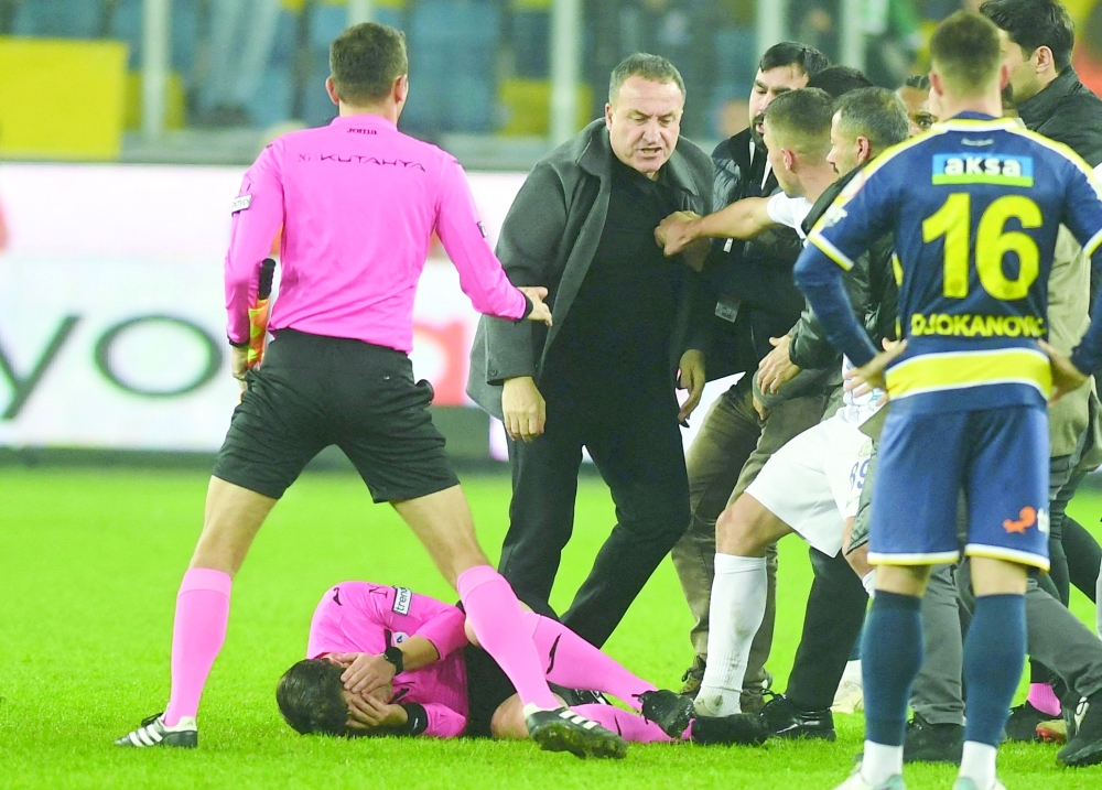 Soccer Football - Super Lig - MKE Ankaragucu v Caykur Rizespor - Eryaman Stadium - Ankara, Turkey - December 11, 2023 MKE Ankaragucu President Faruk Koca reacts as the referee Halil Umut Meler lies on the ground at the end of their Super Lig home match against Caykur Rizespor.
