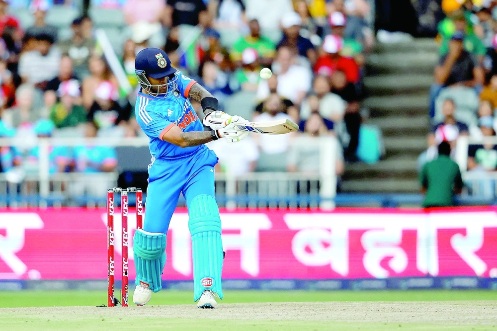India's Suryakumar Yadav hits a six during the third T20 cricket match between South Africa and India at the Wanderers Stadium in Johannesburg on December 14, 2023. (Photo by PHILL MAGAKOE / AFP)

