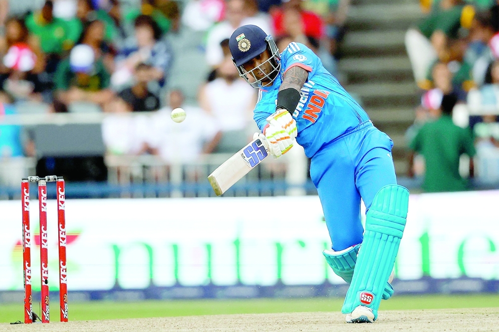 India's Suryakumar Yadav hits a six during the third T20 cricket match between South Africa and India at the Wanderers Stadium in Johannesburg on December 14, 2023. (Photo by PHILL MAGAKOE / AFP)

