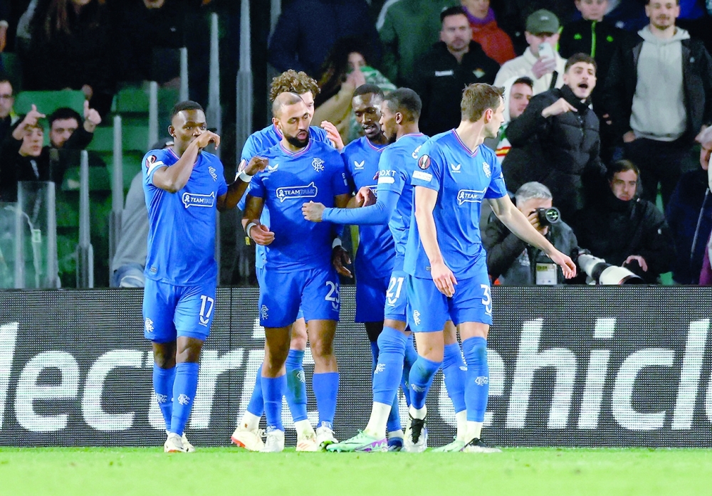 Soccer Football - Europa League - Group C - Real Betis v Rangers - Estadio Benito Villamarin, Seville, Spain - December 14, 2023  Rangers' Kemar Roofe celebrates scoring their third goal with team-mates REUTERS/Marcelo Del Pozo