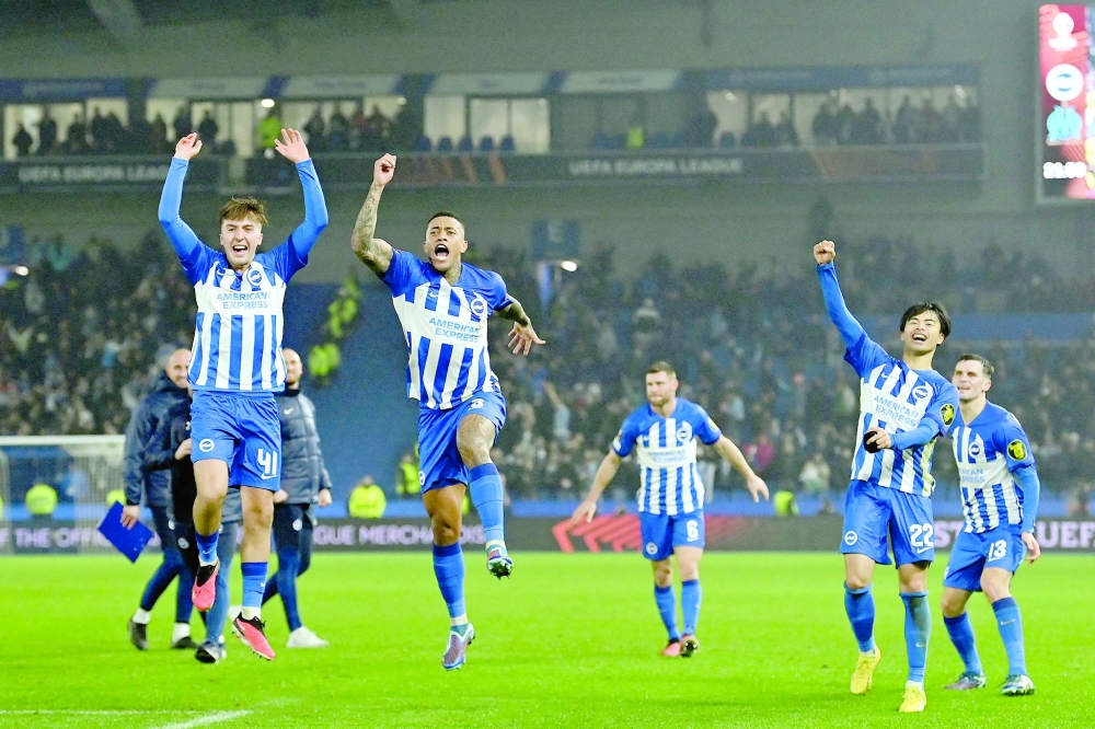Brighton's players celebrate on the pitch after the UEFA Europa League Group B football match between Brighton and Hove Albion and Marseille at the American Express Community Stadium in Brighton, southern England on December 14, 2023. Brighton won the game 1-0 and top the Group. (Photo by Glyn KIRK / AFP)