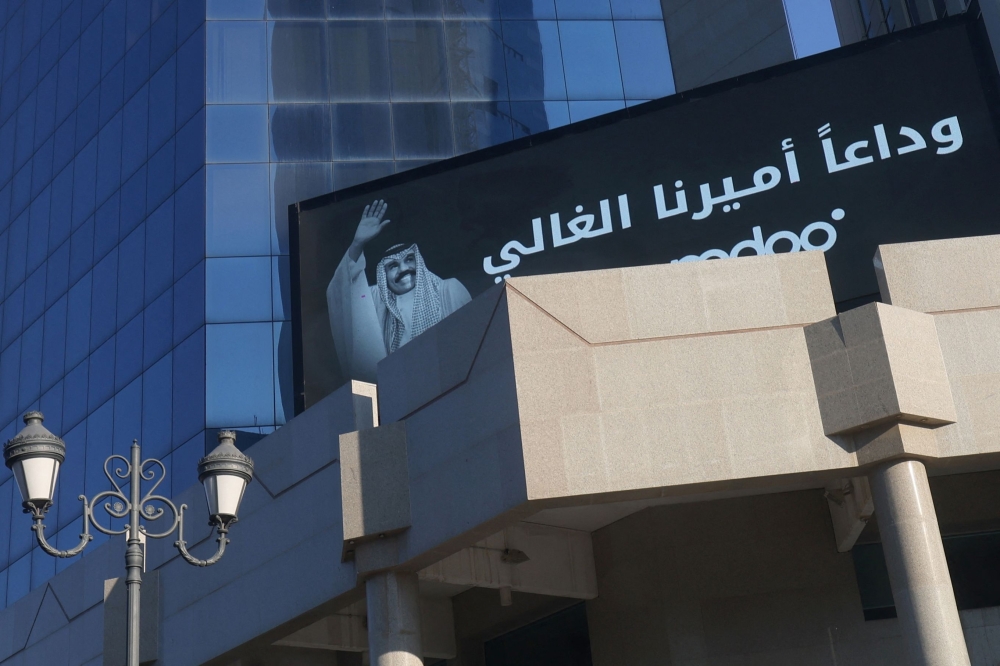A billboard showing a message of condolences and the picture of Kuwait's late Emir Shaikh Nawaf al Ahmad al Sabah is displayed on a building in the centre of Kuwait City on Sunday. - AFP