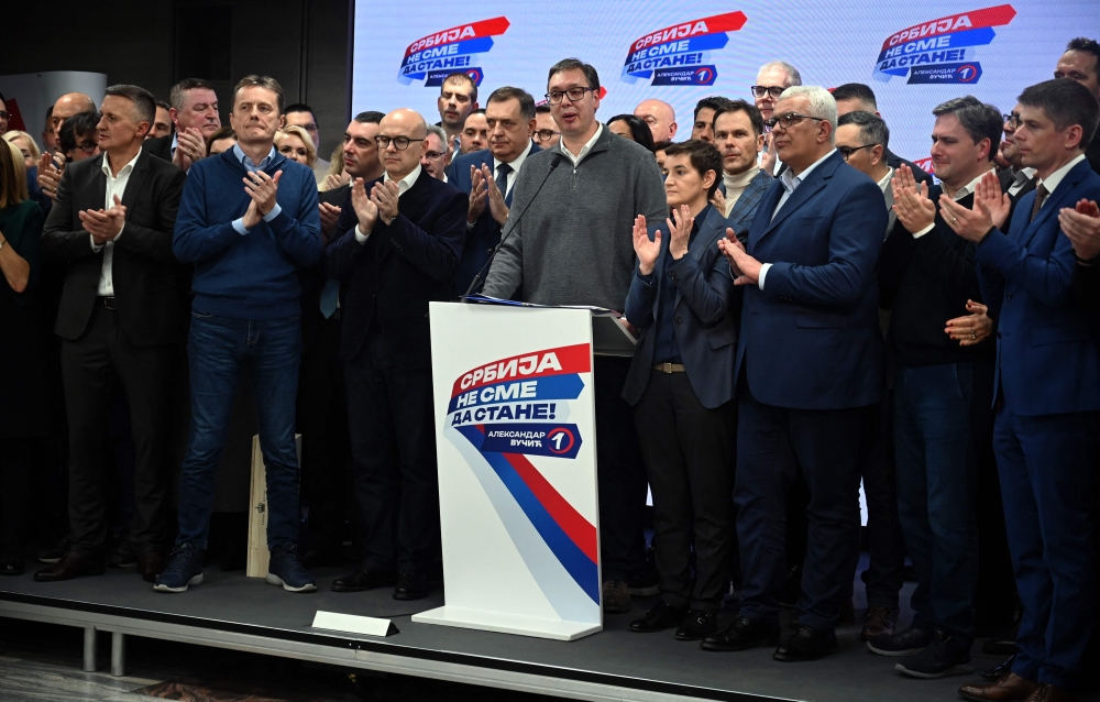 Serbian president, Aleksandar Vucic (C), addresses media at the headquarters of Srpska Napredna Stranka (Serbian Progressive Party) in Belgrade. — AFP