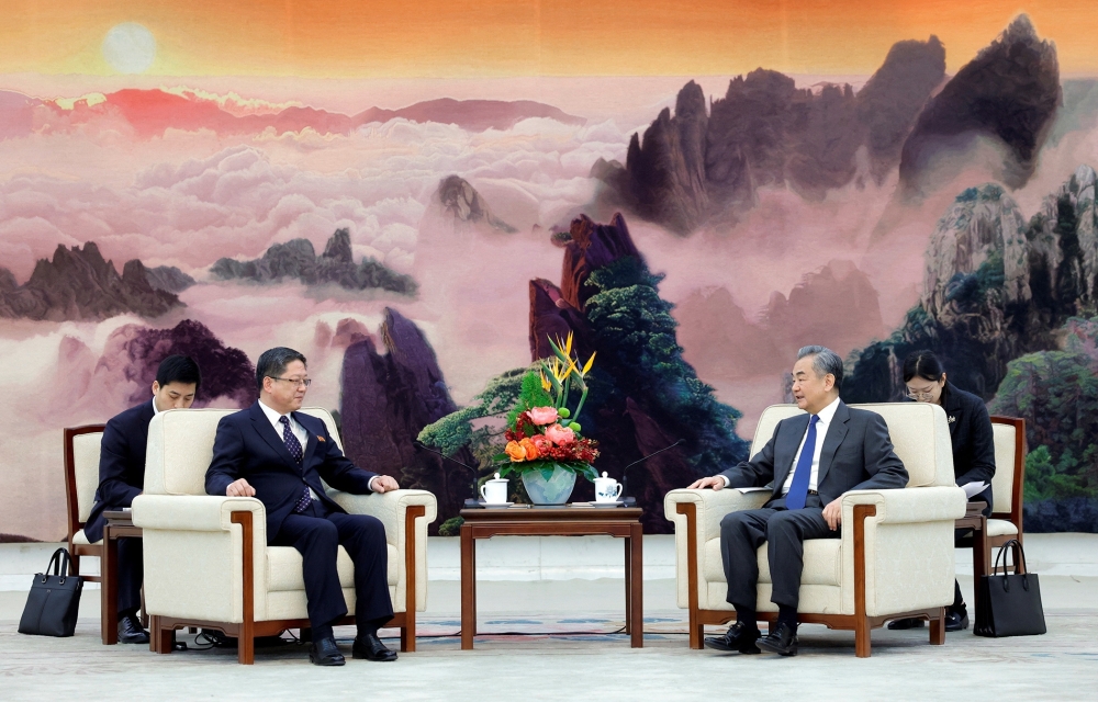 Chinese Foreign Minister Wang Yi and North Korean Vice Minister of Foreign Affairs Pak Myong Ho attend a meeting in Beijing, China. — Reuters.
