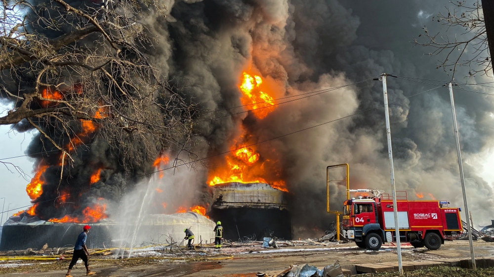 Firemen work to extinguish fire after a blast at an oil terminal in Conakry, Guinea. — Reuters 