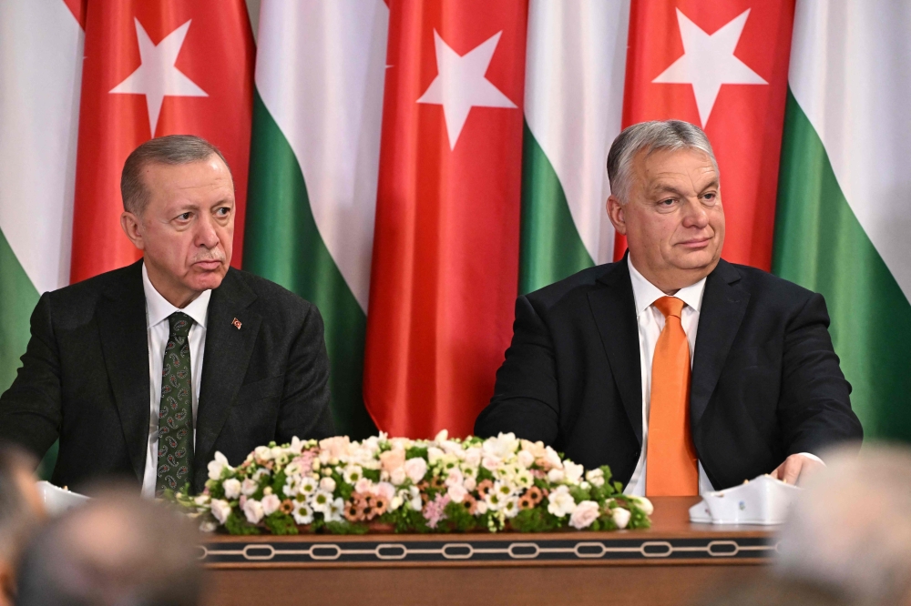 Hungarian Prime Minister Viktor Orban (R) and Turkish President Recep Tayyip Erdogan attend a joint press conference after talks at the prime minister's office at the Carmelite Monastery in Budapest, Hungary. — AFP 