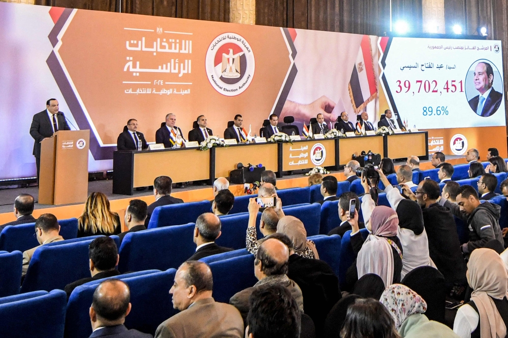 Hazem Badawy (L), head of Egypt's National Elections Authority, announces the results of the 2024 Egyptian presidential elections in Cairo. — AFP