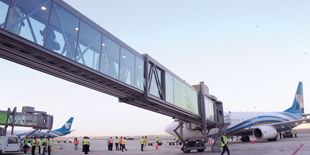 Triple passenger boarding bridge at Muscat International Airport 