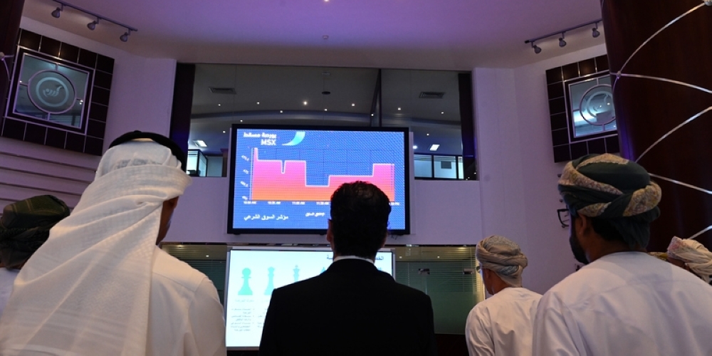 Traders work on the floor of the Muscat Stock Exchange, in this illustration photo. 