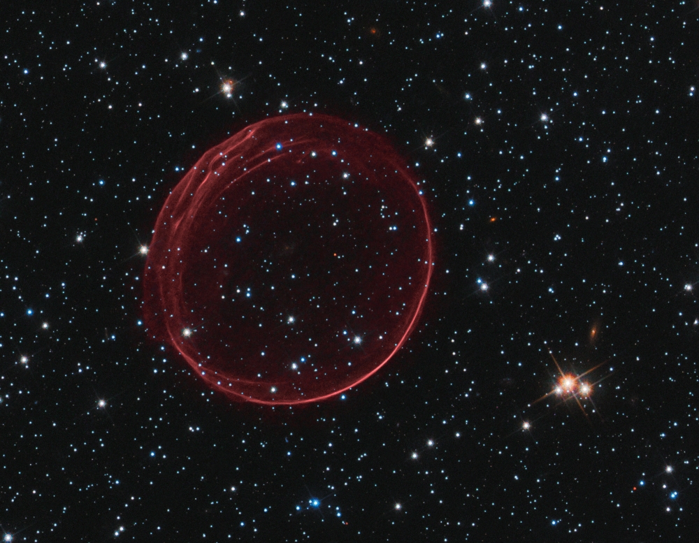 A bubble known as SNR 0509-67.5, the visible remnant of stellar explosion in the Large Magellanic Cloud, about 160,000 light-years from Earth.
