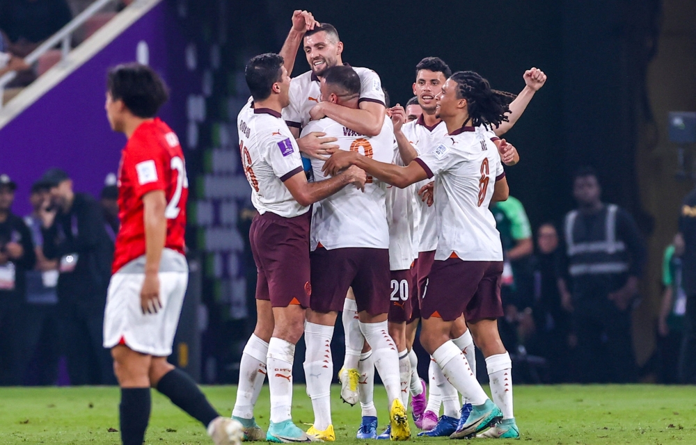 Manchester City's players celebrate after scoring the team's second goal during the Fifa Club World Cup football semifinal match between England's Manchester City and Japan's Urawa Red Diamonds at King Abdullah Sports City in Jeddah on December 19, 2023. (Photo by AFP)