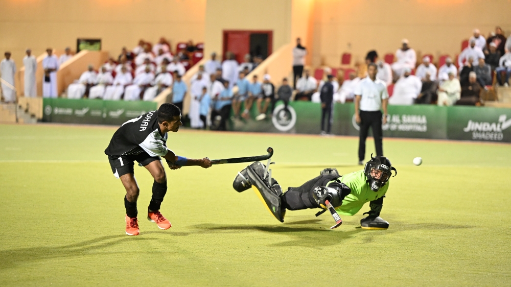 A Sohar player scores past Ahli Sidab goalkeeper during the penalty shoot-out. -- Abdulwahid al Hamdani