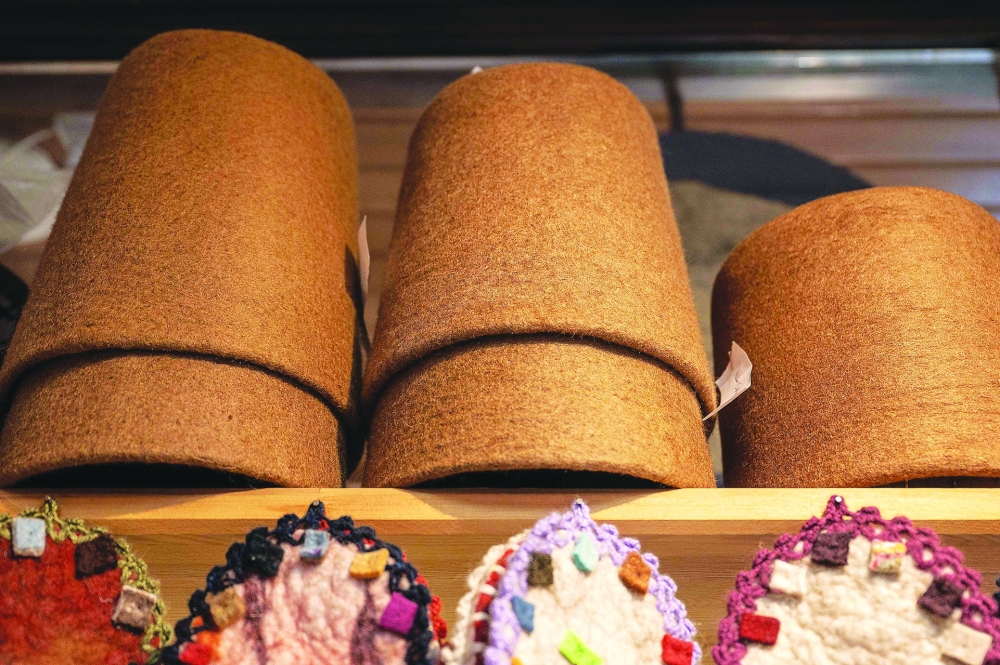 Symbolic hats 'Sikke', worn by whirling dervishes, are displayed on the shelf of a workshop in Konya. - AFP