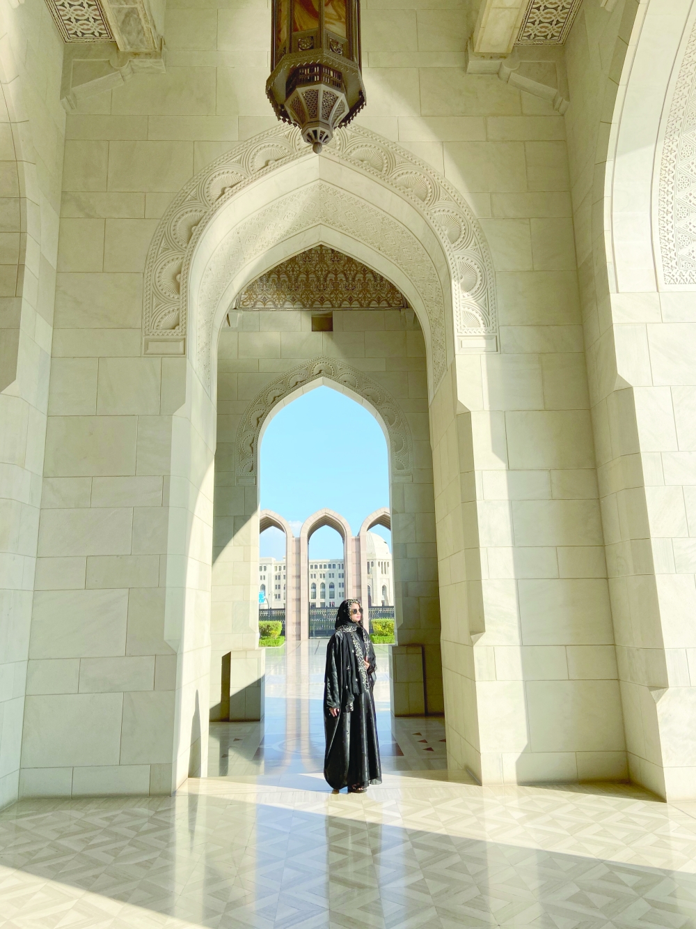 Hiroshini stands before Muscat Grand mosque