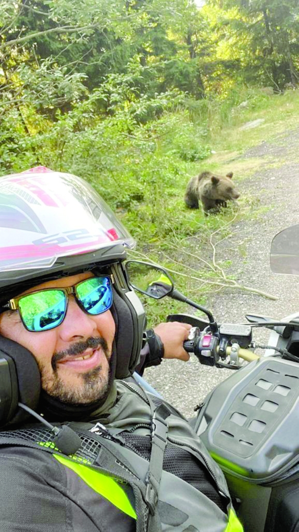 Wael bin Salem al Yaqoubi tries selfie with a wild bear in the highest mountains of Romania