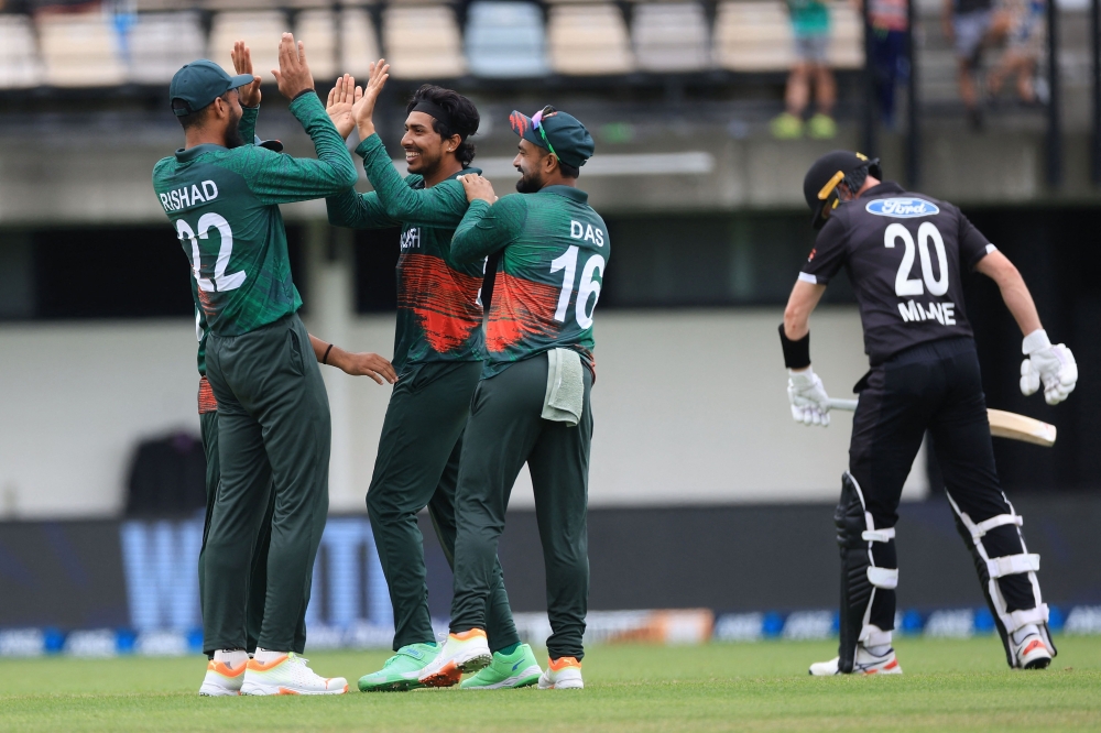 Bangladesh celebrate bowling New Zealand's Josh Clarkson (R) during the 3rd ODI cricket match between New Zealand and Bangladesh at McLean Park in Napier on December 23, 2023. 