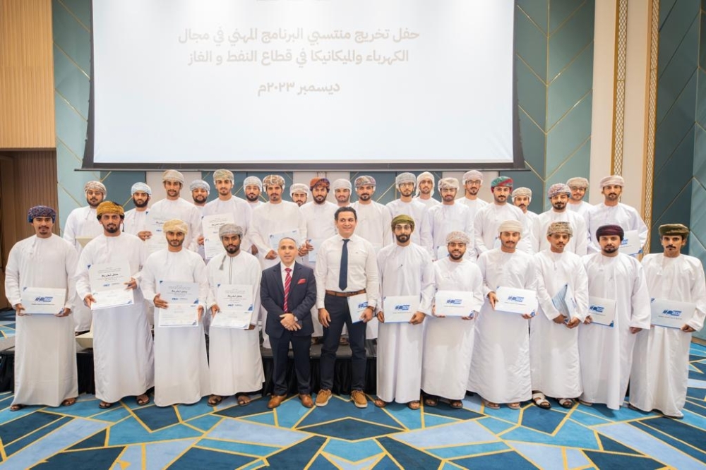 Graduates and guests pose for a photo after the graduation ceremony.
