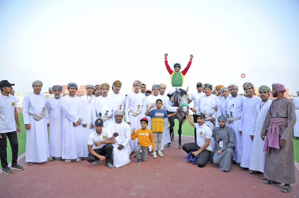 Royal Cavalry celebrate after winning the Oman Derby Cub