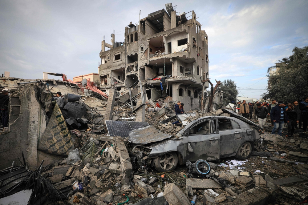 Palestinians inspect the damage at the Al-Maghazi refugee camp after an overnight Israeli strike. — AFP 