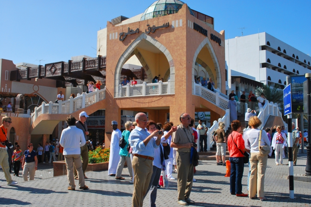 Tourists are seen at the Muttrah Souk in Oman.