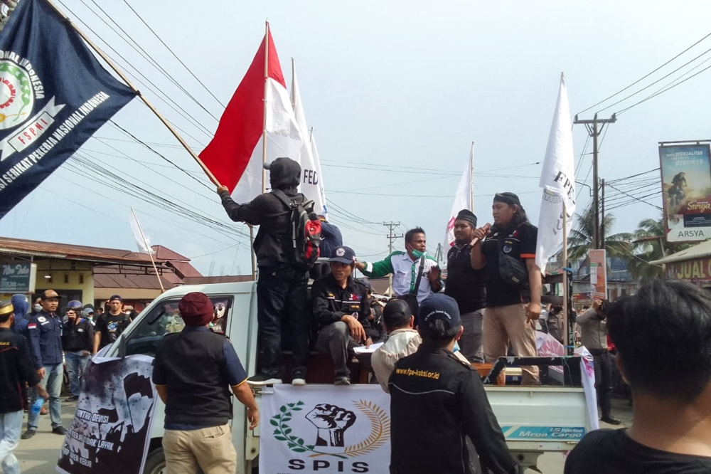 Indonesia Morowali Industrial Park (IMIP) workers protest against their working conditions outside the facility in Bungku, South Sulawesi. - AFP