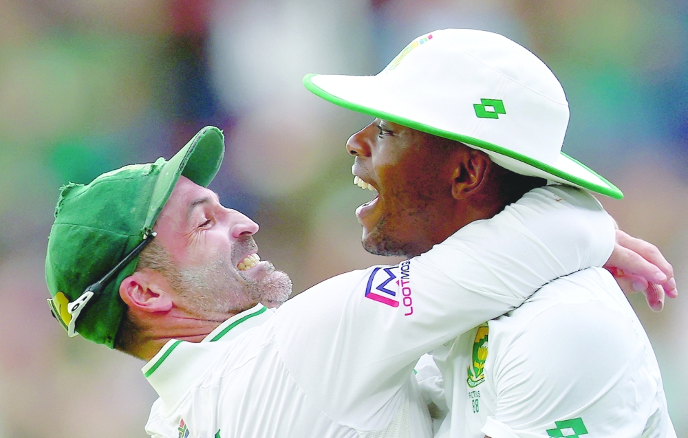 First Test - South Africa v India - SuperSport Park Cricket Stadium, Centurion, South Africa - December 28, 2023 South Africa's Kagiso Rabada celebrates after catching out India's Virat Kohli with Dean Elgar to win the match REUTERS/Esa Alexander     TPX IMAGES OF THE DAY